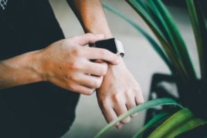 person setting an Apple Watch