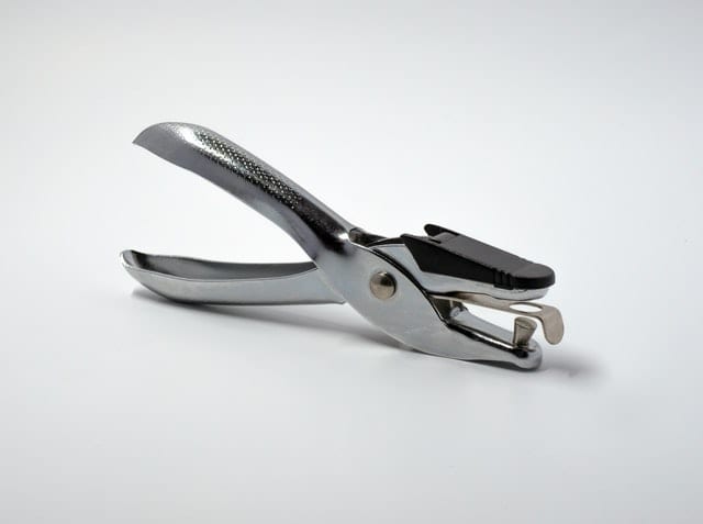 silver handheld holepunch