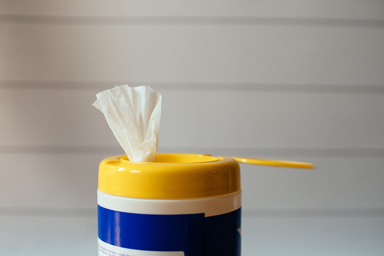 cleaning wipes sprouting from an open cannister