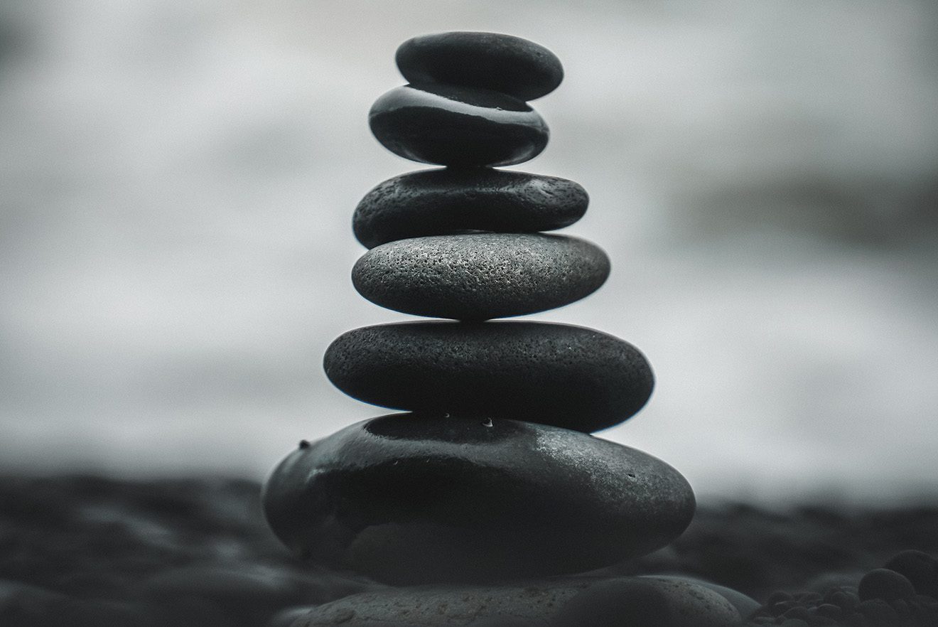 oval shaped rocks stacked atop one another from largest to smallest