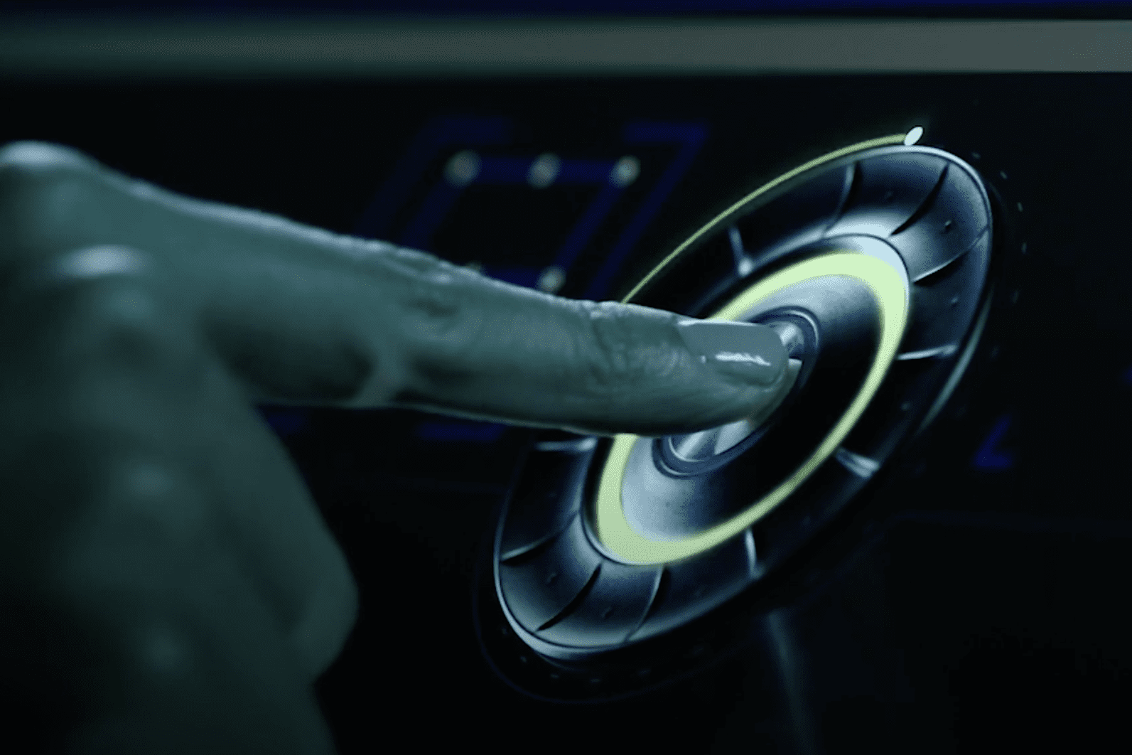 finger touching a push button in the middle of a small wheel component