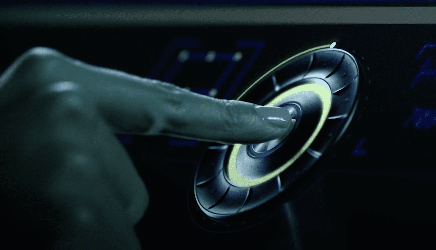 finger touching a push button in the middle of a small wheel component