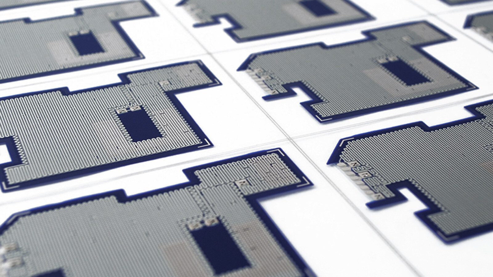 closeup of various printed circuitry boards on white backing