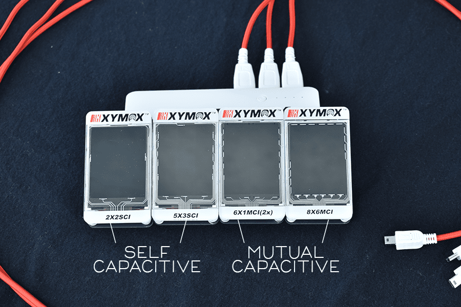 self capacitive and mutual capacitive sensors aligned next to each other with orange wires